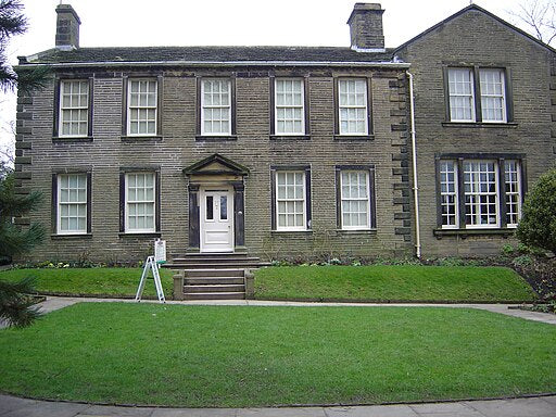 A photograph of the front of the Brontë Parsonage museum house front.